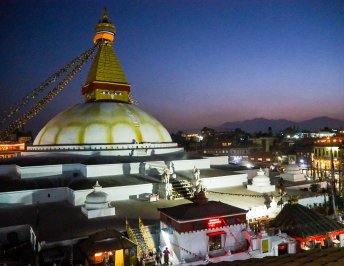 Boudha Stupa at dusk from a nearby rooftop restaurant
