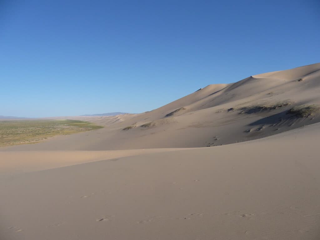 Climbing The Sand Dunes In The Gobi Desert Mongolia