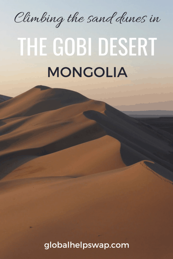 Climbing The Sand Dunes In The Gobi Desert Mongolia